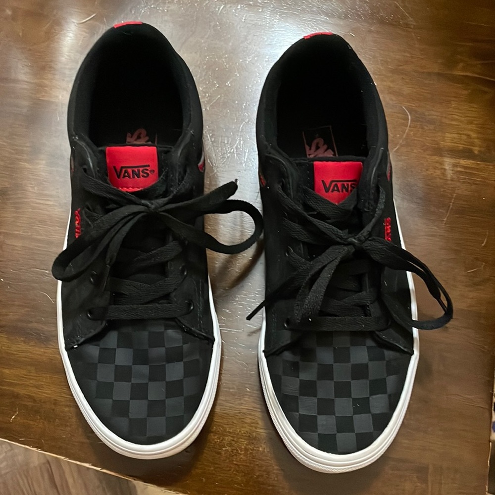 Black and Red checkered Vans. Size 7 women, 5.5 youth.